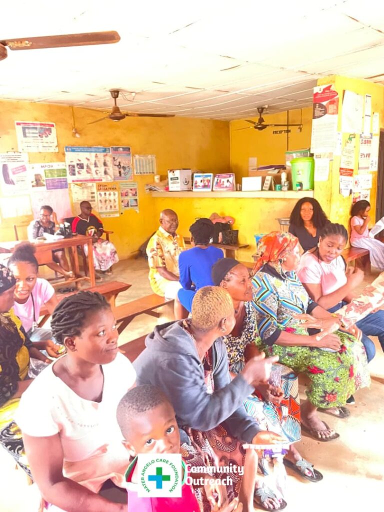 Community members wait and take part in activities inside the health centre.